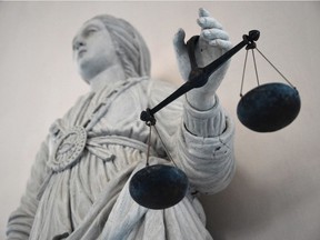 A statue of the goddess of Justice balancing the scales.