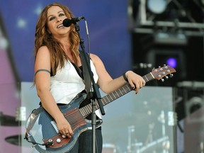 In this file photo taken on June 27, 2008 Canadian singer Alanis Morissette performs on stage at the Rock in Rio Madrid music festival in Arganda del Rey near Madrid.