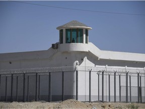 This file photo taken on May 31, 2019 shows a watchtower on a high-security facility near what is believed to be a re-education camp where mostly Muslim ethnic minorities are detained, on the outskirts of Hotan, in China's northwestern Xinjiang region.