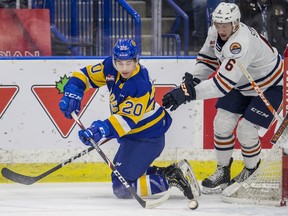 Saskatoon Blades forward Alex Morozoff moves the puck while on his knees against the Kamloops Blazers in 1st period WHL action at SaskTel Centre in Saskatoon, SK on Friday, December 13, 2019. (Saskatoon StarPhoenix/Liam Richards)