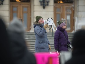 Ada Dechene uses a megaphone to address the crowd at the Nov. 29 climate strike in Regina.