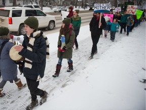 Alex Flett bangs a drum during the climate strike on Nov. 29 in Regina.
