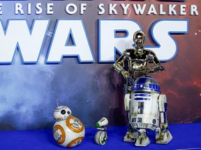 Star Wars robots R2-D2 and BB8 and droids C3P0 and D-0 pose as they attend the premiere of "Star Wars: The Rise of Skywalker" in London, December 18, 2019. (REUTERS/Henry Nicholls/File Photo)