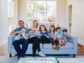 Saskatoon pop/country singer Elly Thorn sits with her husband and children. Thorn will be performing some of her own music with the Saskatoon Symphony Orchestra at their Dec. 7, 2019 concert at TCU Place.