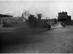 A photo of icy streets being gravelled, from Jan. 16, 1954. (City of Saskatoon Archives StarPhoenix Collection S-SP-B2355-1)