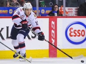 Cole Dubinsky #18 of the Regina Pats carries the puck against Egor Zamula #9 of the Calgary Hitmen during a WHL game at the Scotiabank Saddledome on October 14, 2018 in Calgary.