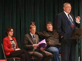 Mayoral candidate Devon Hein gives fellow candidate Charlie Clark bunny ears as candidate Don Atchison speaks at a Mayor's forum at Luther Heights in Saskatoon on October 5, 2016. Candidate Kelley Moore is seated at left.