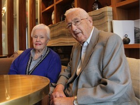 Ted Hughes, right, the former Saskatchewan Court of Queen's Bench Justice, B.C. conflict of interest commissioner and head of numerous public commissions was in Saskatoon on Oct. 12, 2017 with his wife Helen Hughes, left, a former Saskatoon City councillor, to promote his new biography "The Mighty Hughes." Ted Hughes died recently in British Columbia.