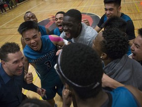 The Bishop McNally Timberwolves celebrate after winning the 2019 BRIT championship game against the Harry Ainlay Titans.