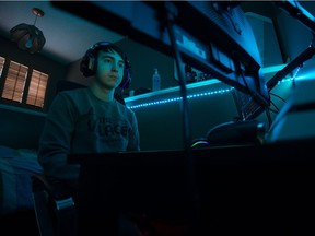 Alex Gonzalez-Aldana, a pro video gamer under contract with the Vancouver Whitecaps FC, plays FIFA 20 in his basement bedroom in Regina, Saskatchewan on Dec. 7, 2019.