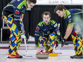 Skip Rylan Kleiter, centre, watches his rock as teammates Joshua Mattern, left, and Matthieu Taillon prepare to sweep during a match against Team Bernath at the Saskatchewan provincial junior curling championships at Sutherland Curling Club in Saskatoon on Monday, Dec. 30, 2019.