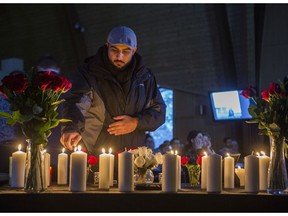 Imam Chaudhry lights candles during a vigil for the people killed in the crash of Ukraine International Airlines flight 752, organized by the University of Saskatchewan Iranian Students Council at the Graduate StudentsÕ Association (GSA) Commons on the U of S campus in Saskatoon, SK on Friday, January 10, 2020.