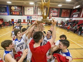 Handsworth Royals post George Horn celebrates with the trophy and his teammates after they defeat the Raymond High School Comets in the championship game at BRIT at Bedford Road Collegiate in Saskatoon, SK on Saturday, January 11, 2020.Saskatoon StarPhoenix/Liam Richards