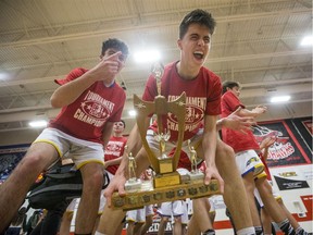 Handsworth Royals post George Horn celebrates with the trophy and his teammates after they defeat the Raymond High School Comets in the championship game at BRIT at Bedford Road Collegiate in Saskatoon, SK on Saturday, January 11, 2020. Saskatoon StarPhoenix/Liam Richards
