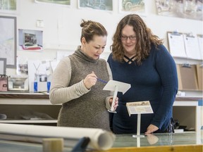 Elizabeth Scott, left, curator of the Western Development Museum, and curatorial assistant Kaiti Hannah with WDM displays/signage models for the museum at the WDM office in Saskatoon on Jan. 23, 2020.