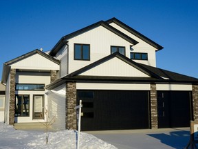 Located in Aspen Ridge, Pawluk Homes' new show home features a unique layout, with the main bedroom on the main level and the kids bedrooms above the garage.