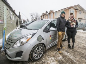 Brainsport owner Brian Michasiw, left, and Megan Van Buskirk, coordinator of Saskatoon CarShare Co-operative, stand beside the solar powered vehicle that will be parked just off Broadway. The vehicle is one of 5 electric vehicles that Saskatoon CarShare Co-operative operates.  Photo taken in Saskatoon, Sask. on Jan. 27, 2020.