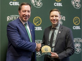 The Saskatchewan Rattlers GM Barry Rawlyk shakes hands with newly announced head coach Chad Jacobson in Saskatoon on Wednesday, January 29, 2020.