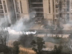 An unconfirmed gif showing an area in China being sprayed down.