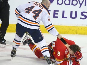 Oilers Zack Kassian and Flames Matthew Tkachuk battle in the second period during NHL action between the Edmonton Oilers and the Calgary Flames in Calgary on Saturday, January 11, 2020.