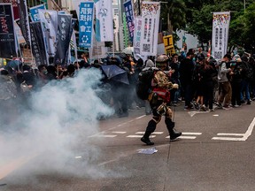 Tear gas is fired by police during a pro-democracy march in Hong Kong on Jan. 1, 2020.