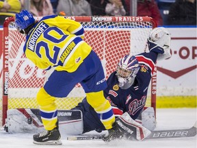 Regina Pats goaltender Donovan Buskey stops a penalty shot from Saskatoon Blades forward Alex Morozoff during the first period of WHL action at SaskTel Centre in Saskatoon on Wednesday, February 5, 2020.