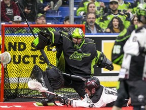 Rush goaltender Evan Kirk stops a shot from Colorado Mammoth forward Dylan Kinnear during an NLL game this past weekend.