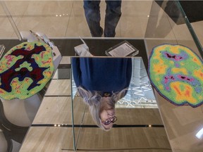 Artist Ruth Cuthand, who is receiving a Governor GeneralÕs Award in Visual and Media Arts, seen i a reflection with some of her work at the Remai Modern in Saskatoon, SK on Thursday, February 20, 2020.