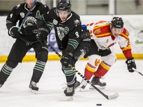 University of Saskatchewan Huskies captain Tanner Lishchynsky moves the puck against the University of Calgary Dinos in Canada West men's hockey semifinal action at Merlis Belsher Place.