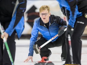 Delores Syrota watches her rock move down the ice during a Thursday-morning game against Kim Hodson.