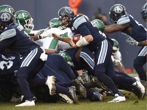 Toronto Argonauts quarterback Cody Fajardo rushes for the game-winning touchdown against the visiting Saskatchewan Roughriders in the CFL's 2017 East Division final.
