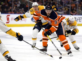 The Edmonton Oilers Connor McDavid (97) battles the Nashville Predators' Roman Josi (59), Kyle Turris (8) and Viktor Arvidsson (33) during third period NHL action at Rogers Place, in Edmonton Saturday Feb. 8, 2020. The Oilers won 3-2.