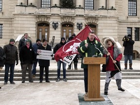 A solo protester shouts at Premier Scott Moe as he speaks at a rally at the Regina & District Chamber of Commerce and Canada Action planned at the Legislative Building to support Canadian pipeline projects, oil & gas development, mining projects, and agriculture development.