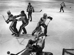 A photo from a hockey game between the University of Saskatchewan Huskies and the University of Calgary Dinosaurs, from March 5, 1982. (City of Saskatoon Archives StarPhoenix Collection S-SP-A18134-3)