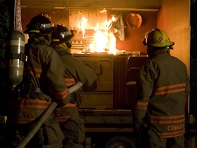 Saskatoon firefighters extinguish a purpose-set kitchen fire during a training exercise in 2012.