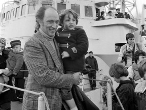 Prime Minister Pierre Elliott Trudeau walks off Destroyer holding a young Justin Trudeau in 1976. (Steve Bosch / Vancouver Sun)