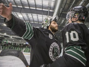 University of Saskatchewan Huskies goalie Taran Kozun, left, and forward Levi Cable — shown here celebrating their Canada West semifinal playoff win over the University of Calgary Dinos at Merlis Belsher Place — both won major awards at the U Sports national all-Canadian awards banquet Wednesday night in Halifax, N.S.