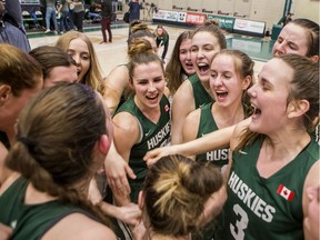 The University of Saskatchewan Huskies cheer after defeating the University of Alberta Pandas in the Canada West women's basketball conference final at the PAC on the U of S campus in Saskatoon on Friday, February 28, 2020.