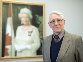 Michael Jackson stand before a portrait of Queen Elizabeth II inside Government House in Regina.