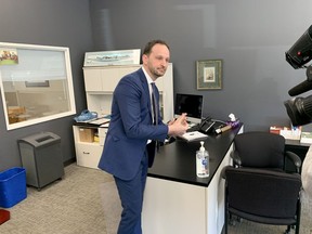 Saskatchewan NDP Leader Ryan Meili cleans his hands with hand sanitizer following a news conference calling for more information from the provincial government on the COVID-19 coronavirus response on Friday, March 13, 2020 in Saskatoon. (PHIL TANK/The StarPhoenix)