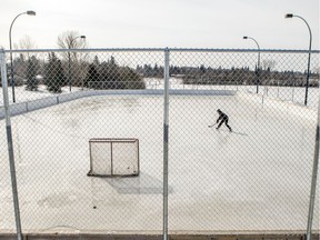 With organized sports essentially shutting down, along with many indoor sports facilities, this hockey player has this outdoor rink to himself in Saskatoon on March 18, 2020.