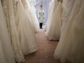 Aimee Schneider, owner of Unveiled Dress Co., in her wedding dress store in Saskatoon on Friday, March 20, 2020.