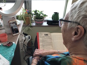 Dr. Jodi Grant, a resident at Sherbrooke Community Centre, reads to grade six students over FaceTime. Before the centre started preventing visitors to limit the spread of COVID-19, the students attended classes at the centre as part of the Intergenerational Classroom (iGen) program, a partnership with the Saskatoon Public School Division. In Saskatoon, SK on Saturday, March 21, 2020.