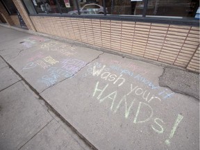 Positive messages written in chalk in front of Hill Ave. Drugs in Regina on Tuesday, March 24, 2020.