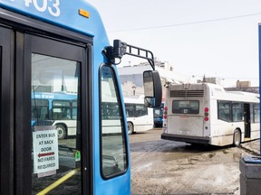 SASKATOON,SK--MARCH 25/2020-0326 news quiet city photo essay- Signs informing Saskatoon Transit bus riders to enter the bus at the back door and that there is no fare on a bus at the bus mall in Saskatoon, SK on Wednesday, March 25, 2020.