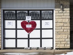 Signs with messages of thanks to front line worker on the garage door of a home on the 2800 block of Louis Avenue in Saskatoon, SK on Thursday, March 26, 2020.
