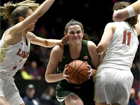 University of Saskatchewan Huskies guard Carly Ahlstrom (3) gets fouled by Universite Laval Rouge Et Or forward Frederique Beauchamp (7) during the second half of semi-final U Sports Final 8 Championships basketball action in Ottawa, on Saturday, March 7, 2020.