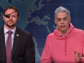 Republican Congressman Dan Crenshaw, left, and Saturday Night Live comedian Pete Davidson appear on SNL's Weekend Update segment. (NBC)