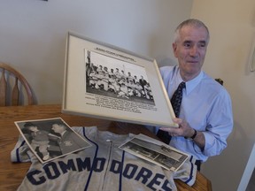 Spero Leakos, shown with some of his baseball memorabilia.