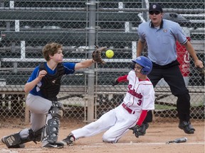 Saskatoon hosted the u-14 Canadian boys' softball championship in the summer of 2019. Here, Nova Scotia Antigonish A's catcher Jack Miller is too late to tag Saskatoon Selects Mikael Parent as he slide into home.